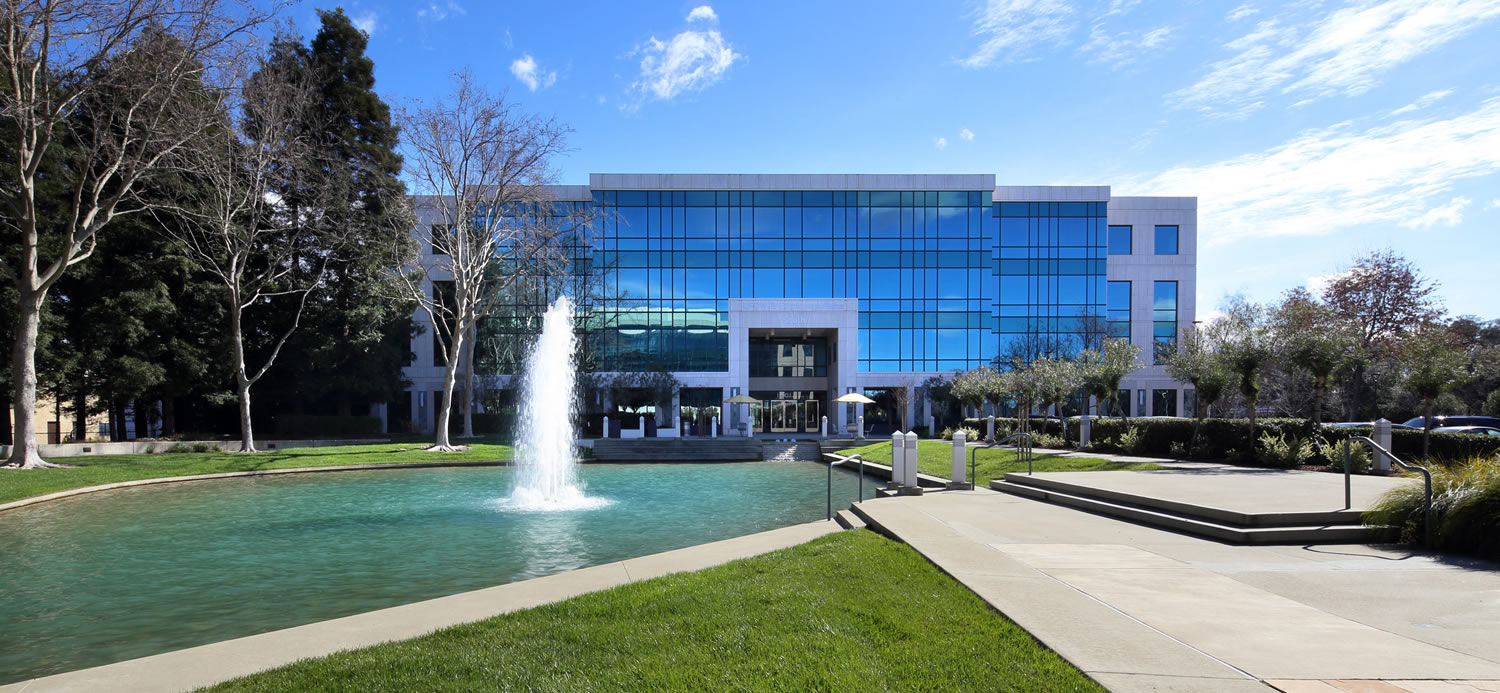 The front facade of UFCW Plaza, a contemporary glass and white concrete building